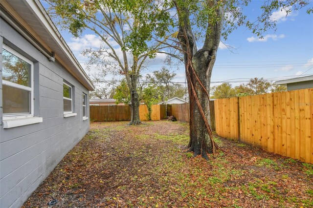 view of yard with a fenced backyard