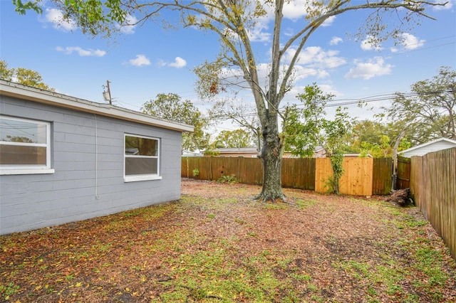 view of yard with a fenced backyard