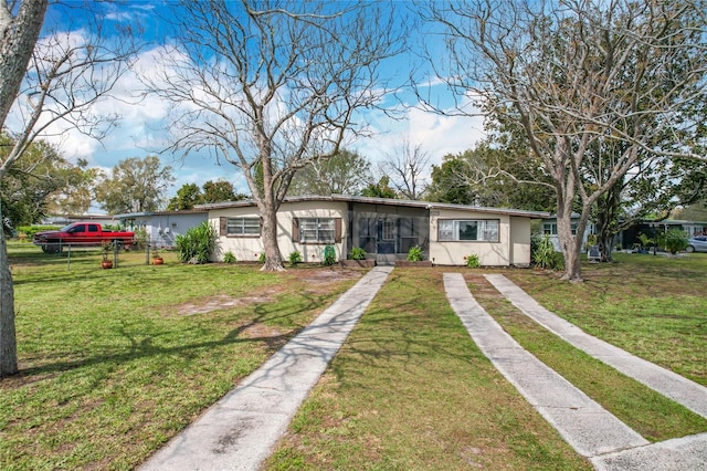 view of front of property with a front yard and stucco siding