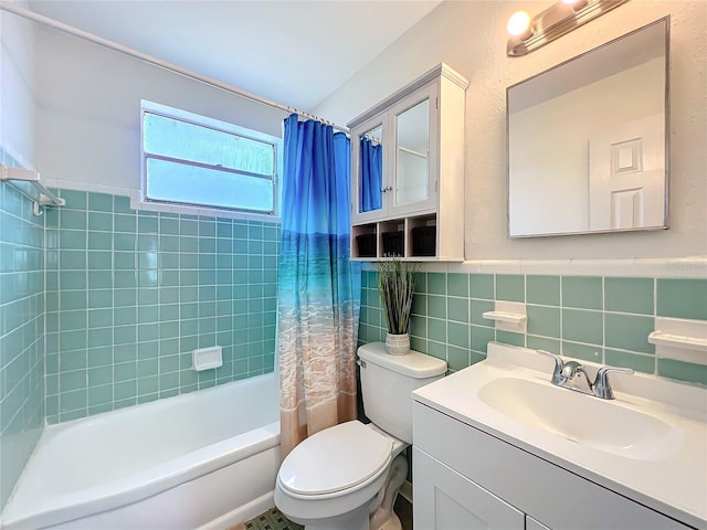 bathroom with toilet, vanity, tile walls, wainscoting, and shower / tub combo with curtain