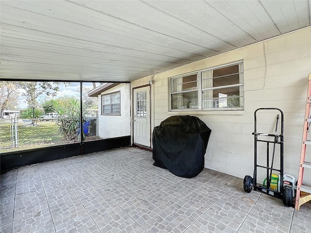 unfurnished sunroom featuring wooden ceiling