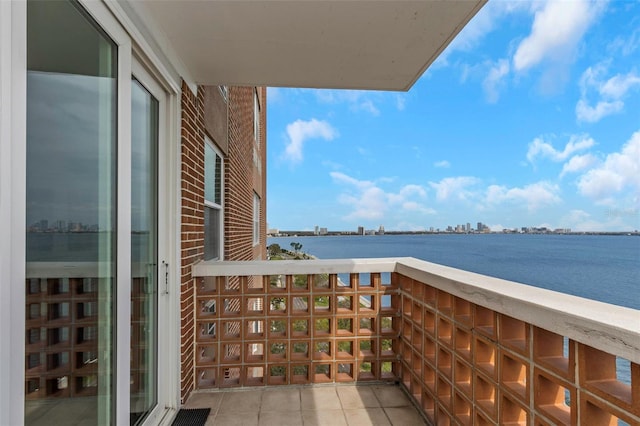 balcony with a view of city and a water view