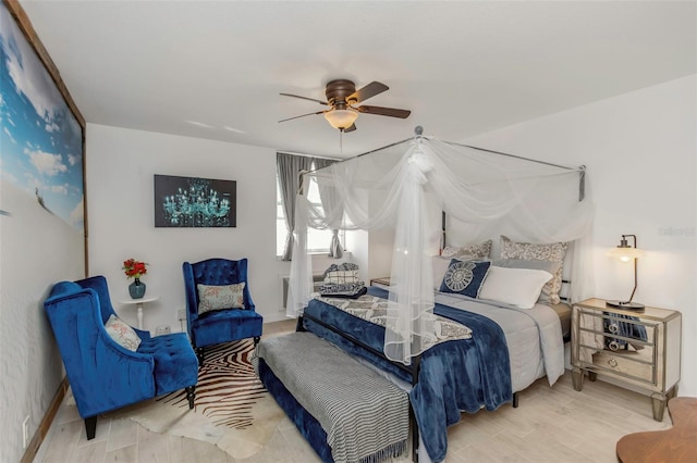 bedroom featuring wood finished floors and ceiling fan