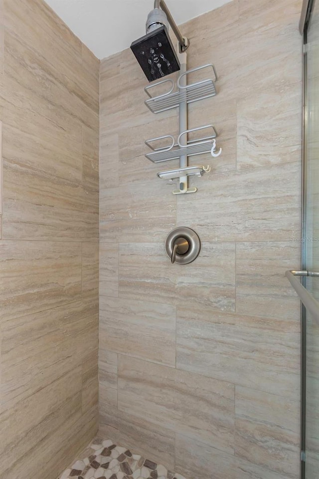 details with a tile shower