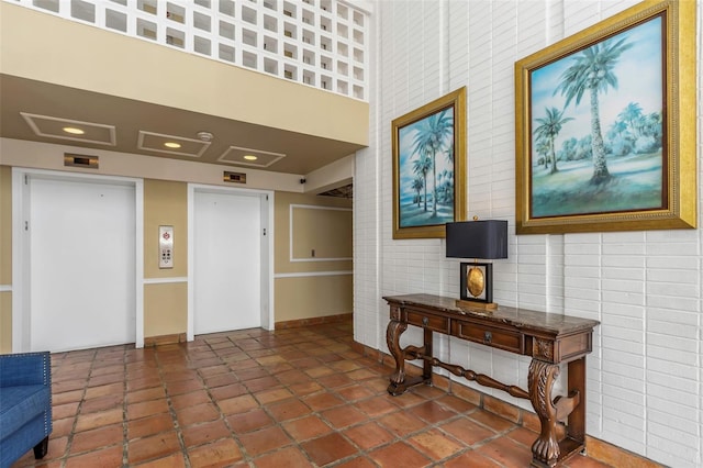 interior space featuring tile patterned floors, elevator, and recessed lighting