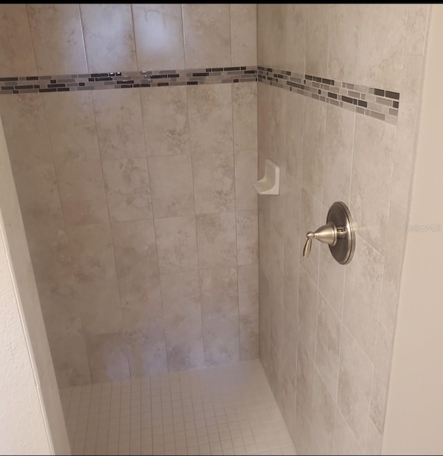 details with a tile shower