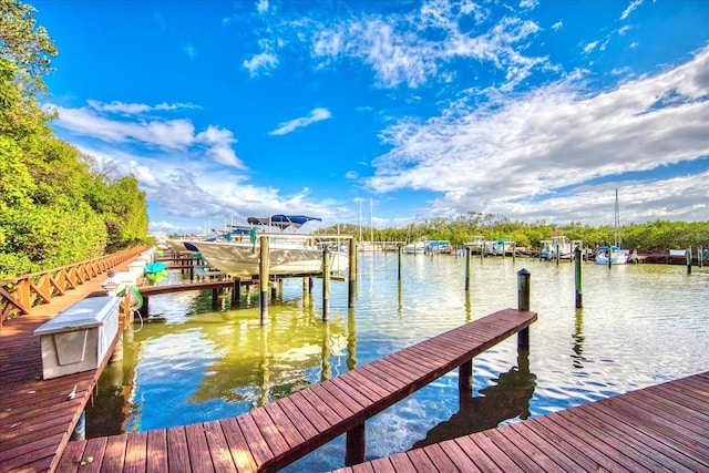 view of dock featuring a water view and boat lift