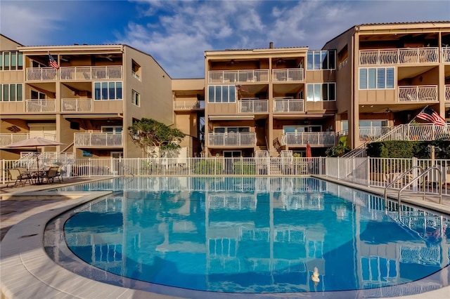 community pool featuring fence