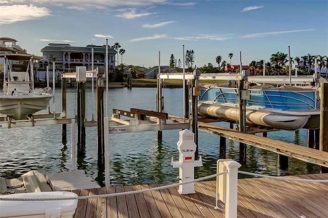 view of dock with a water view and boat lift