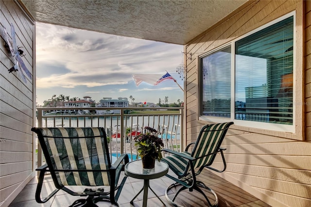 balcony featuring a water view