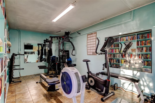 exercise room featuring tile patterned floors