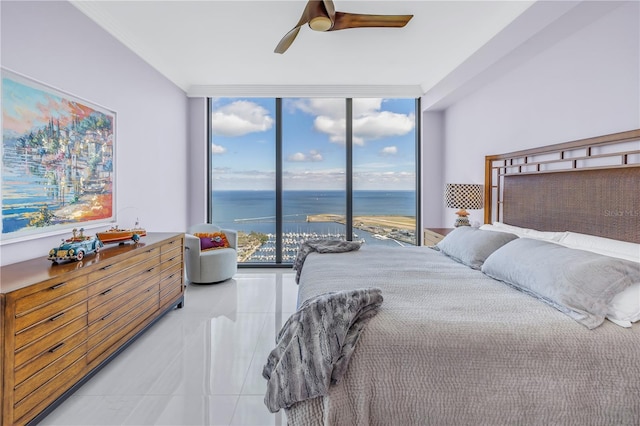 bedroom featuring expansive windows, access to outside, ornamental molding, and a water view