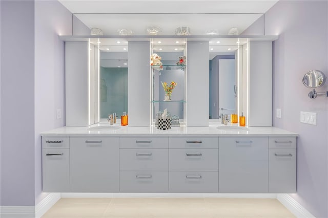 full bathroom with a sink and double vanity