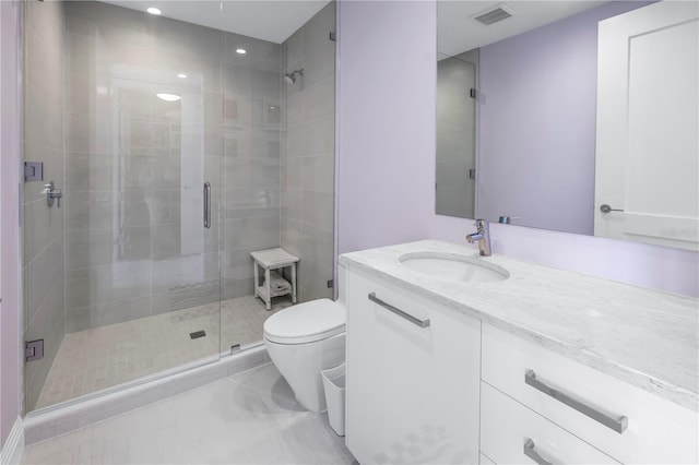 full bathroom with toilet, a stall shower, visible vents, and vanity