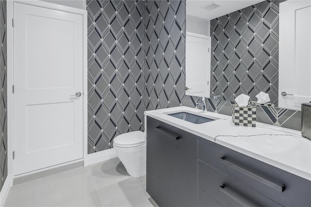 full bathroom with visible vents, vanity, and toilet