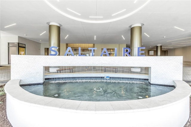 view of pool featuring a jacuzzi