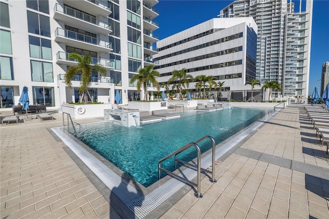 community pool with a patio area