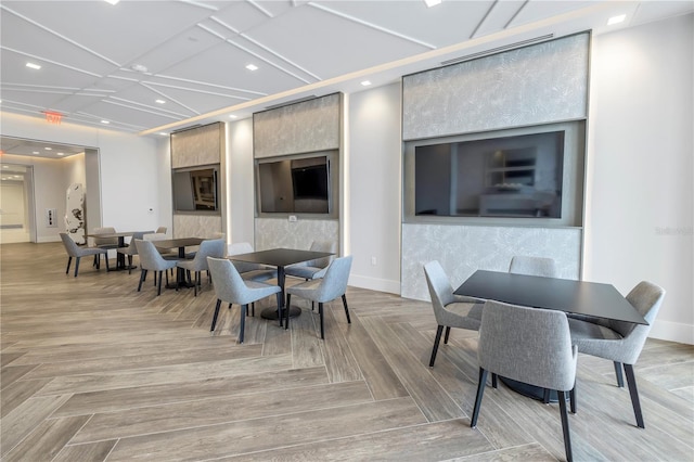 dining space featuring baseboards and recessed lighting