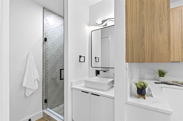 full bathroom featuring a stall shower and vanity