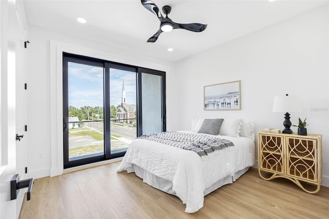 bedroom with access to outside, a ceiling fan, wood finished floors, and recessed lighting