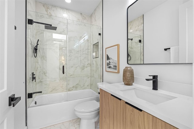 bathroom featuring enclosed tub / shower combo, marble finish floor, toilet, and vanity