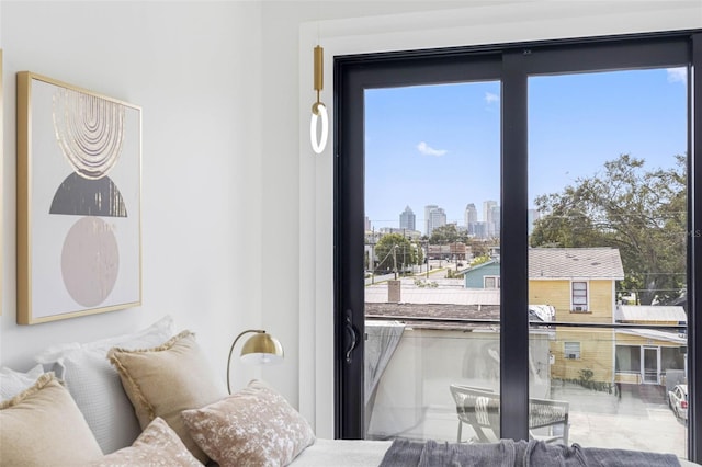 bedroom with a view of city