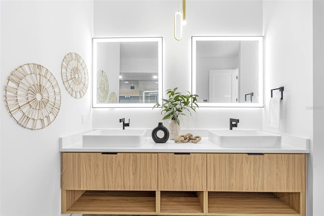 bathroom with double vanity and a sink