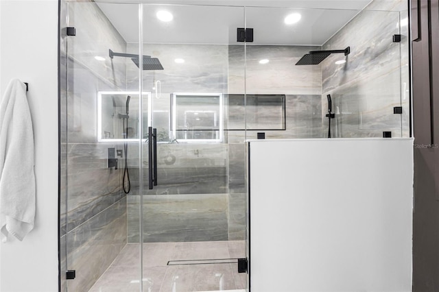 bathroom featuring a stall shower and recessed lighting