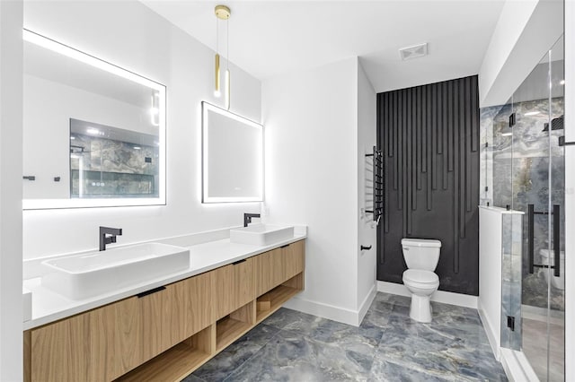 full bathroom featuring visible vents, a sink, toilet, and double vanity