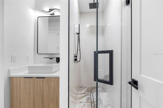 full bathroom featuring a stall shower and vanity