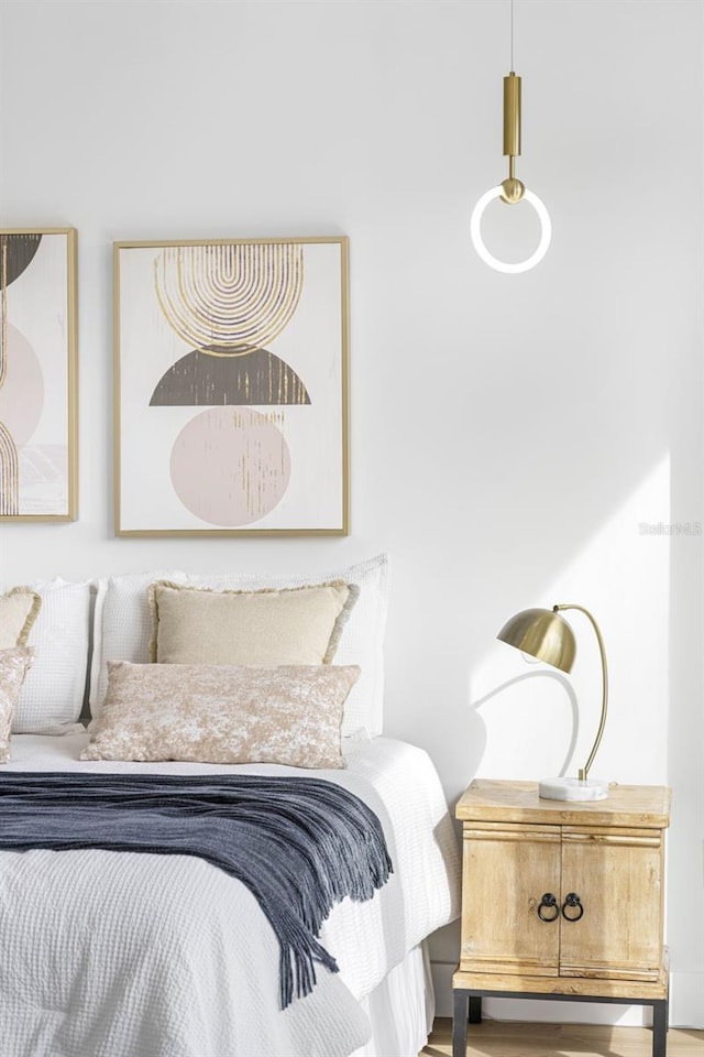 bedroom featuring wood finished floors