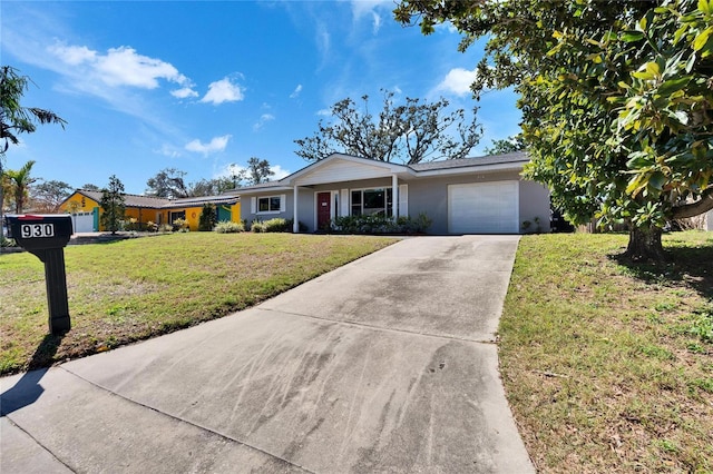 ranch-style home featuring a front yard, concrete driveway, an attached garage, and stucco siding