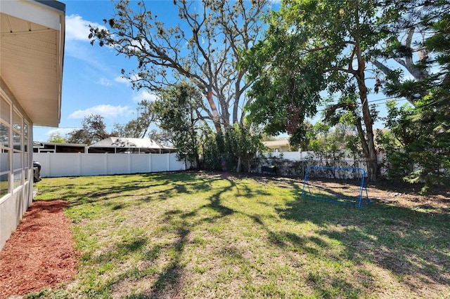 view of yard with a fenced backyard