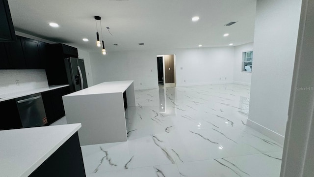 kitchen with dishwasher, fridge with ice dispenser, marble finish floor, and dark cabinetry