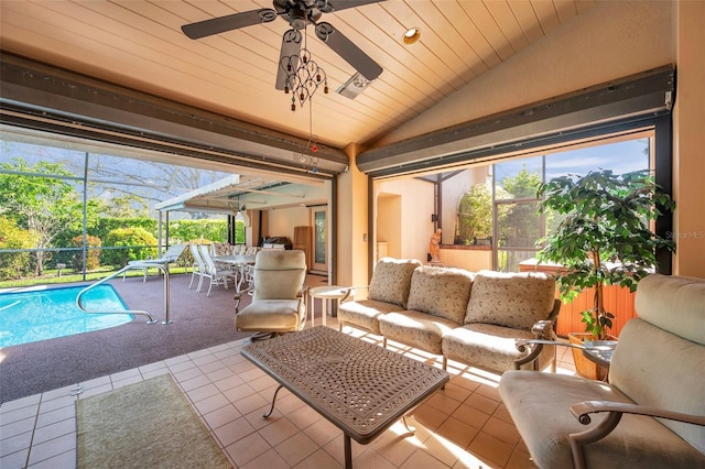 sunroom / solarium featuring vaulted ceiling, ceiling fan, and wooden ceiling