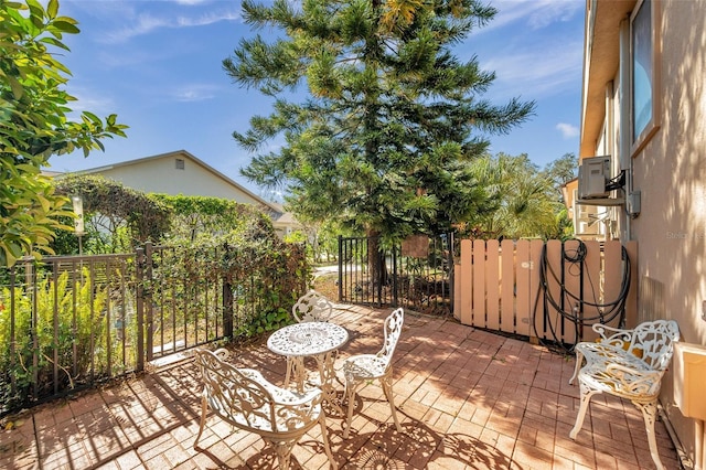 view of patio featuring fence