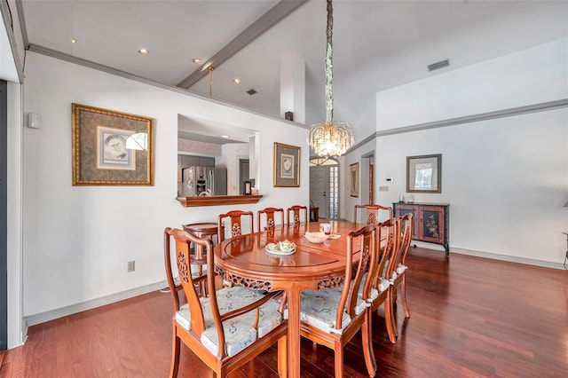 dining room with baseboards, visible vents, ornamental molding, wood finished floors, and an inviting chandelier