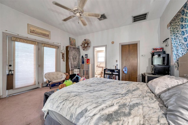 bedroom with access to exterior, ceiling fan, visible vents, and carpet flooring