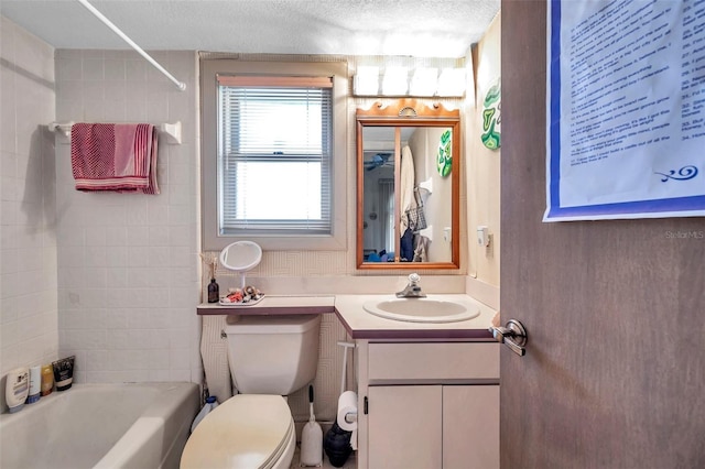 bathroom featuring shower / bath combination, vanity, toilet, and a textured ceiling