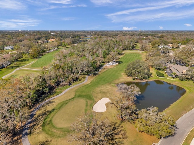 birds eye view of property featuring a forest view, golf course view, and a water view