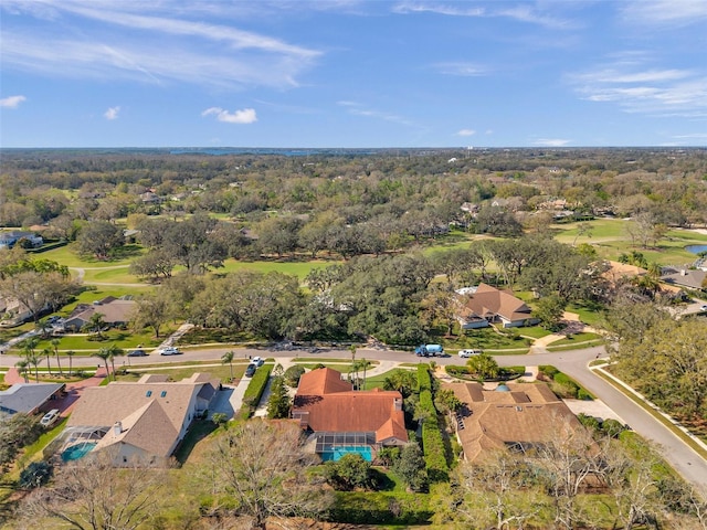 birds eye view of property with a forest view