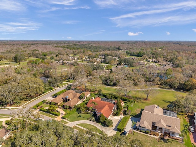 aerial view featuring a wooded view