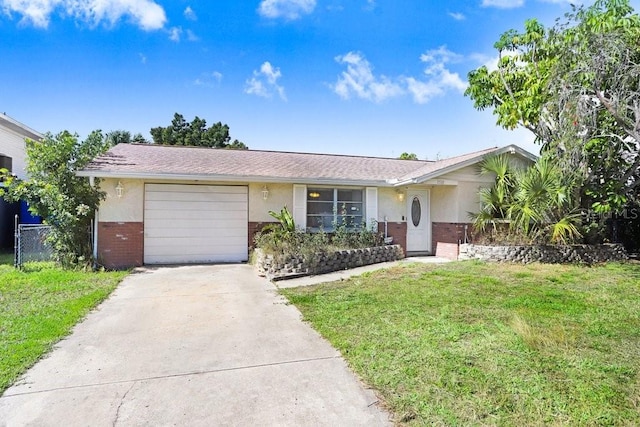 ranch-style house featuring driveway, an attached garage, a front lawn, and brick siding