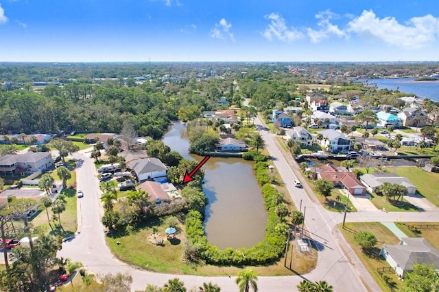 birds eye view of property featuring a residential view and a water view