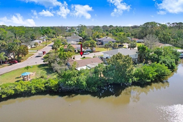 drone / aerial view featuring a water view and a residential view