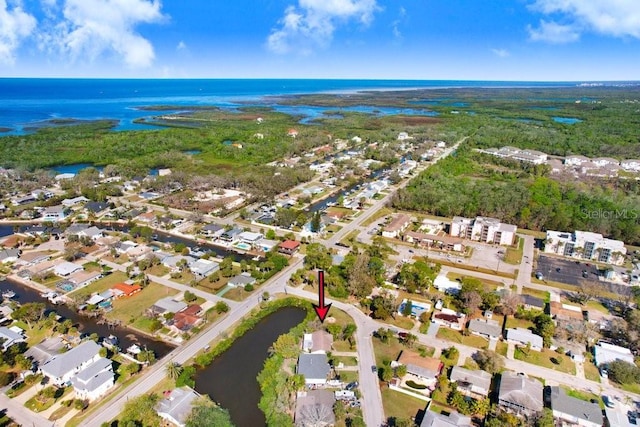 bird's eye view with a water view and a residential view