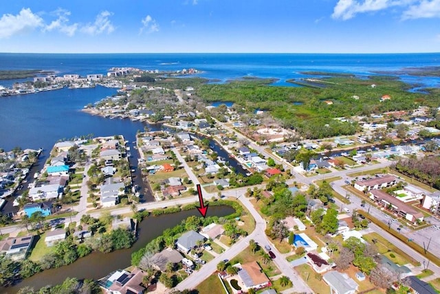 birds eye view of property featuring a water view and a residential view