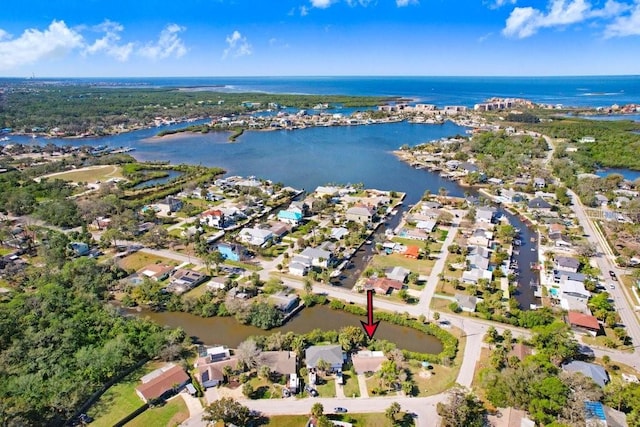 bird's eye view with a residential view and a water view