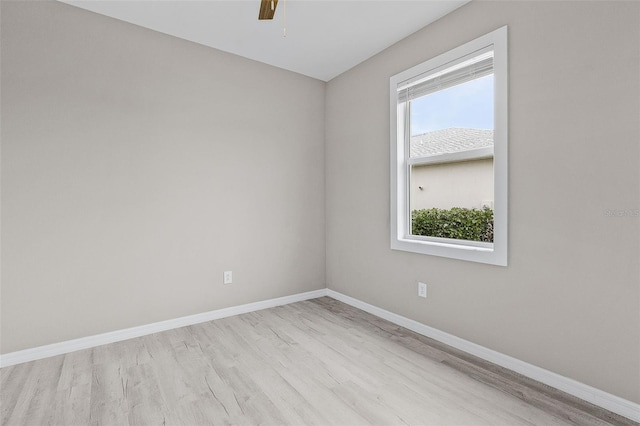 17541 Corkwood Bend Trl, Punta Gorda, FL 33982 - empty room featuring wood finished floors, baseboards, and a ceiling fan