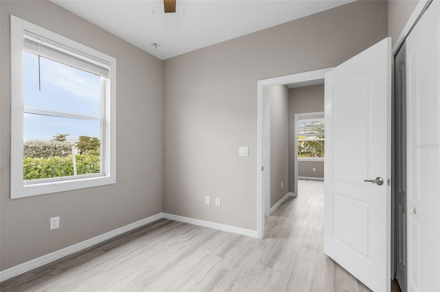 17541 Corkwood Bend Trl, Punta Gorda, FL 33982 - unfurnished room with light wood-type flooring, baseboards, and a ceiling fan